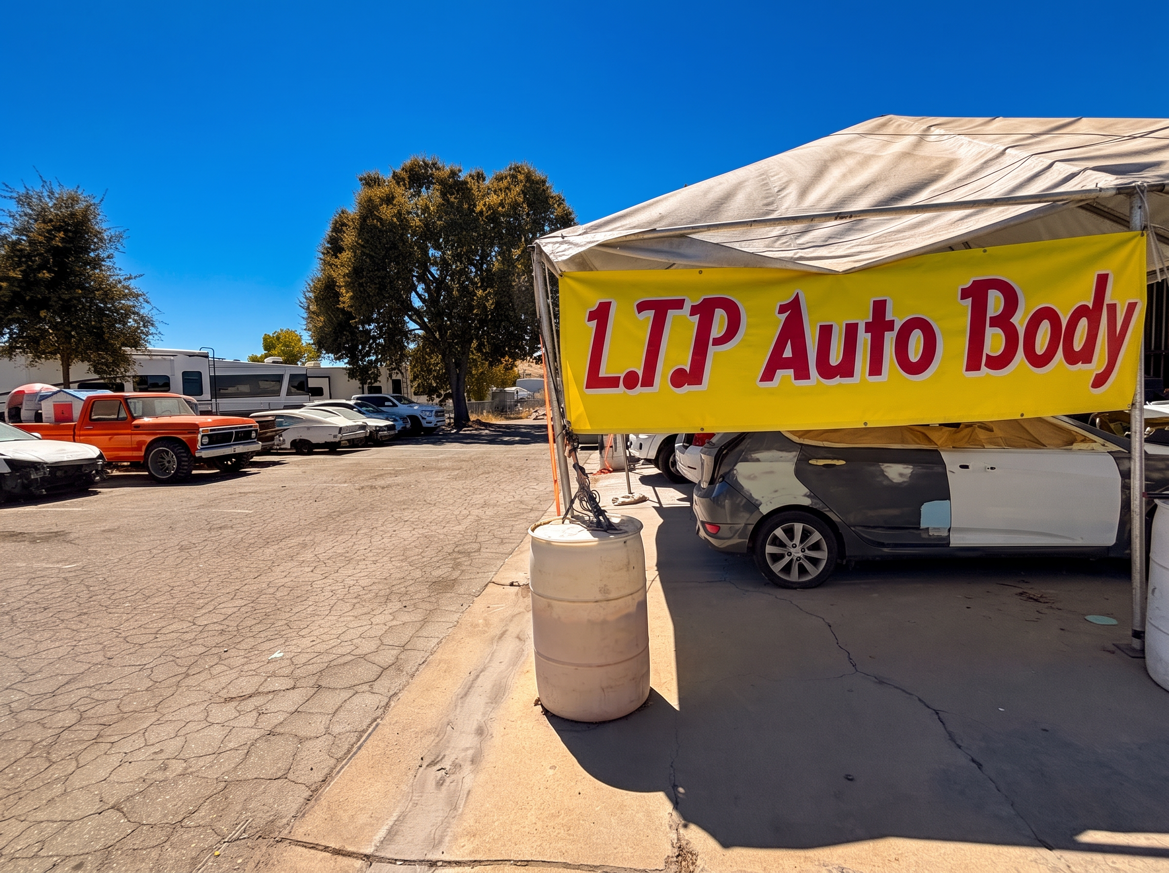 LTP Auto Body sign and work yard in Paso Robles